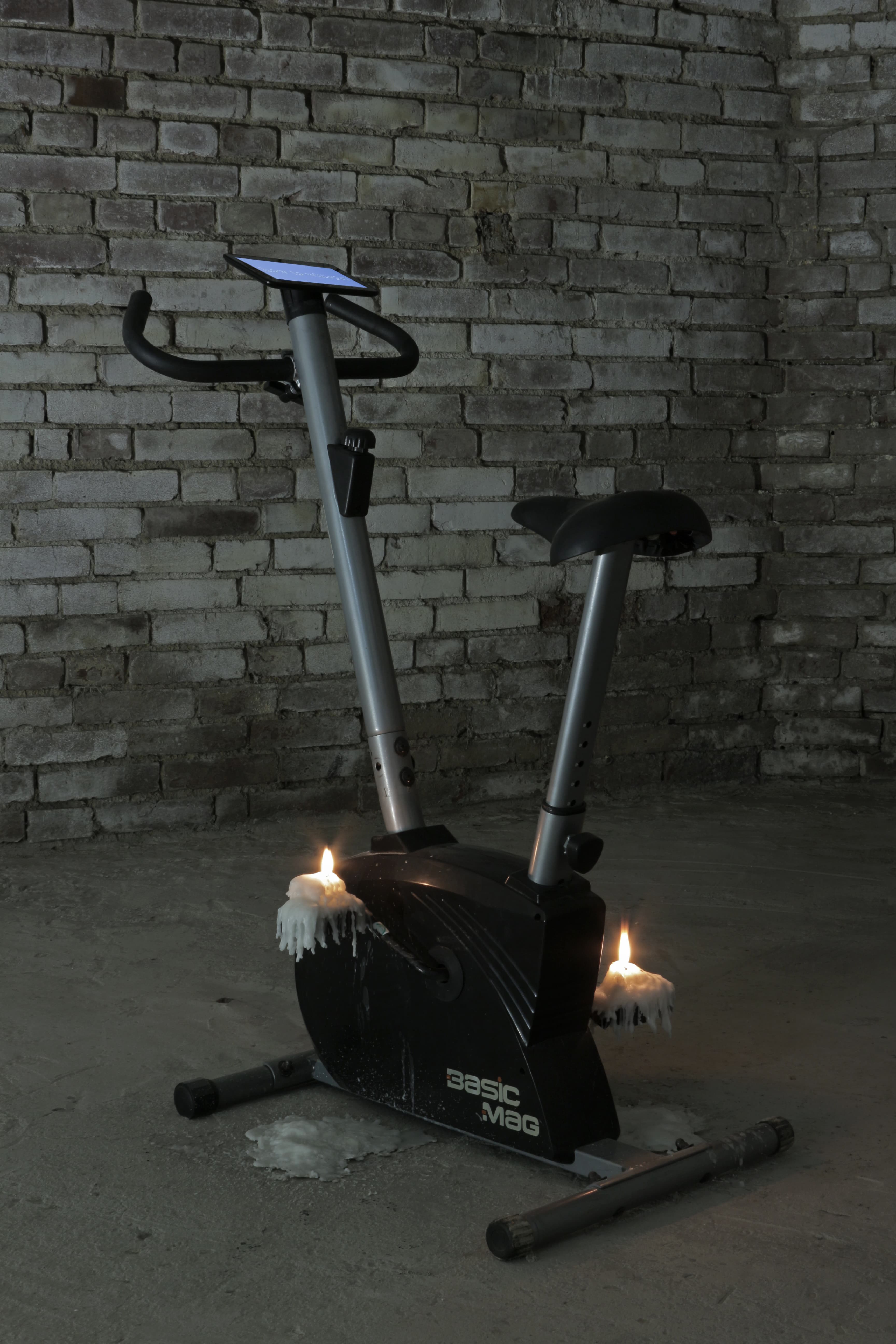 NrdFcng 2019, paraffin, exercise bicycle, tablet, aprox 150 x 110 x 60 cm by Matei Dumitriu